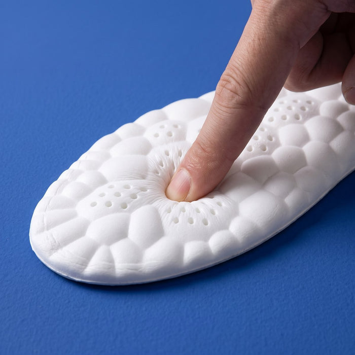 A finger pressing into the soft white cloud foam