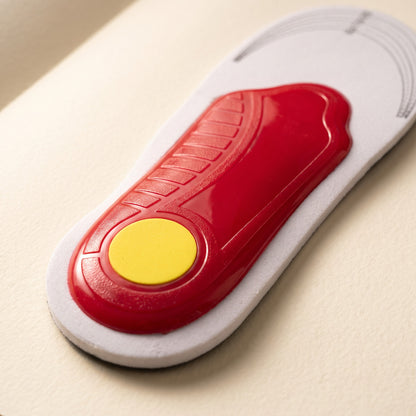 Close up of the red arch shell and yellow heel pad under an Arch Support Insole